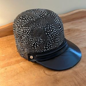 Roberto Cavalli, large feathered jockey hat